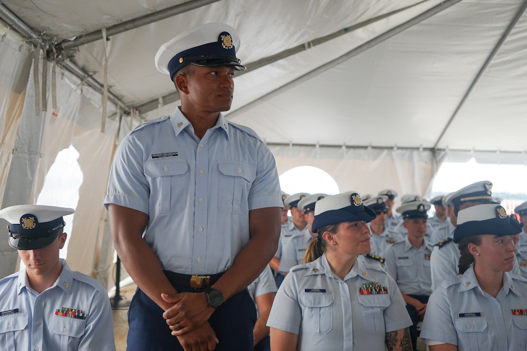 Petty Officer 3rd Class Gilberto Herrera Richardson, a crew member assigned to Coast Guard Cutter Stone (WMSL 758), is one of several members recognized by Capt. Jonathan Carter, commanding officer of Stone, for superior performance during the cutter's change-of-command ceremony in North Charleston, South Carolina, June 5, 2025. The change-of-command ceremony marks the official transfer of total responsibility, authority and accountability from one leader to another. (U.S. Coast Guard photo by Ensign Sarah Pearson)