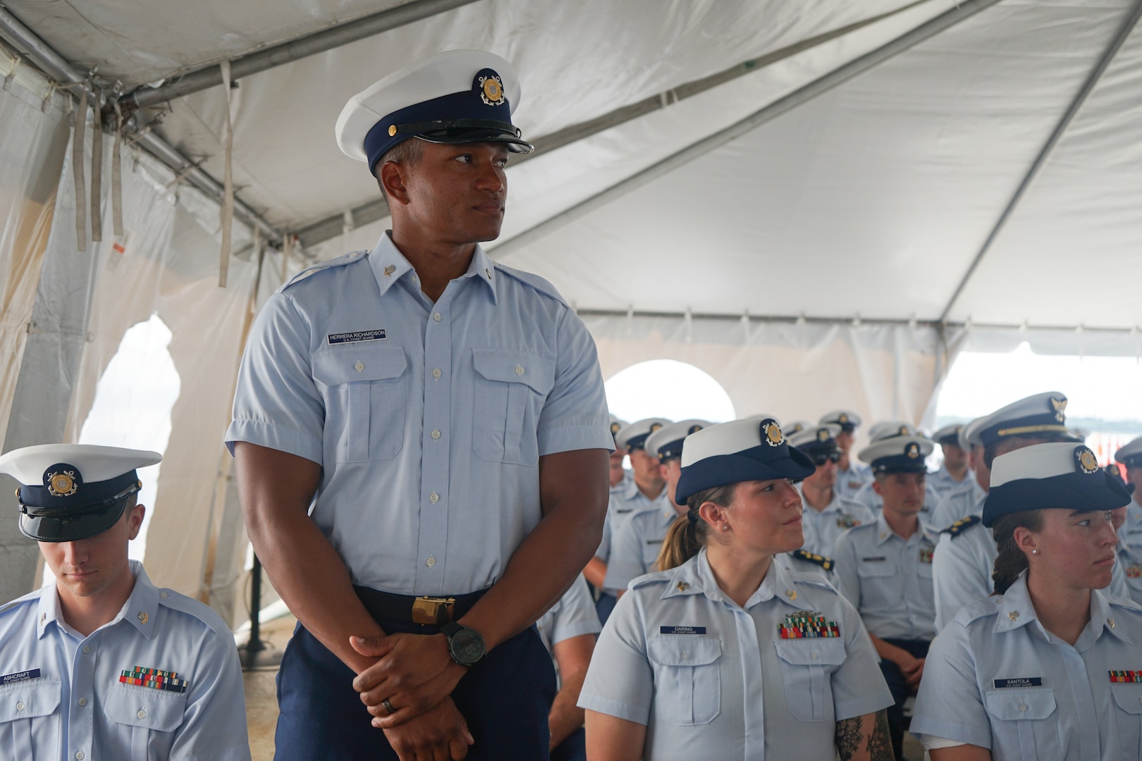 Petty Officer 3rd Class Gilberto Herrera Richardson, a crew member assigned to Coast Guard Cutter Stone (WMSL 758), is one of several members recognized by Capt. Jonathan Carter, commanding officer of Stone, for superior performance during the cutter's change-of-command ceremony in North Charleston, South Carolina, June 5, 2025. The change-of-command ceremony marks the official transfer of total responsibility, authority and accountability from one leader to another. (U.S. Coast Guard photo by Ensign Sarah Pearson)