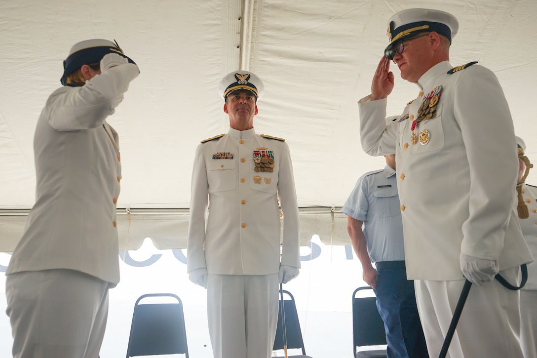 Capt. Anne O’Connell, incoming commanding officer of Coast Guard Cutter Stone (WMSL 758), salutes Capt. Jonathan Carter, outgoing commanding officer of Stone, in front of presiding official Vice Adm. Nathan Moore, commander, Atlantic Area, assembled crew and distinguished guests during the unit's change-of-command ceremony in North Charleston, South Carolina, June 5, 2025. The change-of-command ceremony is a time-honored tradition that formally demonstrates the continuity of authority within a command, conducted before the assembled crew and honored guests. (U.S. Coast Guard photo by Ensign Sarah Pearson)