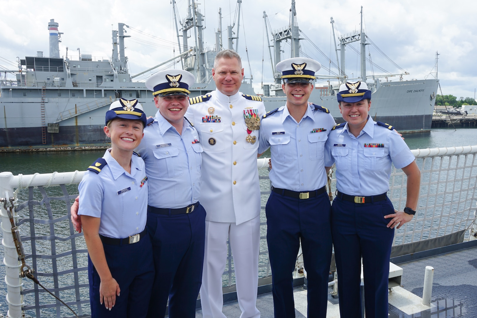 Coast Guard Cutter Stone (WMSL 758) crew members pose for a group photo aboard the cutter after a change-of-command ceremony in North Charleston, South Carolina, June 5, 2025; pictured left to right: Ensigns Sarah Pearson, Noah McMahon, Capt. Jonathan Carter, Ensigns Joshua Soca and Katherine Jensen. Commissioned in 2021, Stone is a 418-foot, Legend-class national security cutter. (U.S. Coast Guard photo)