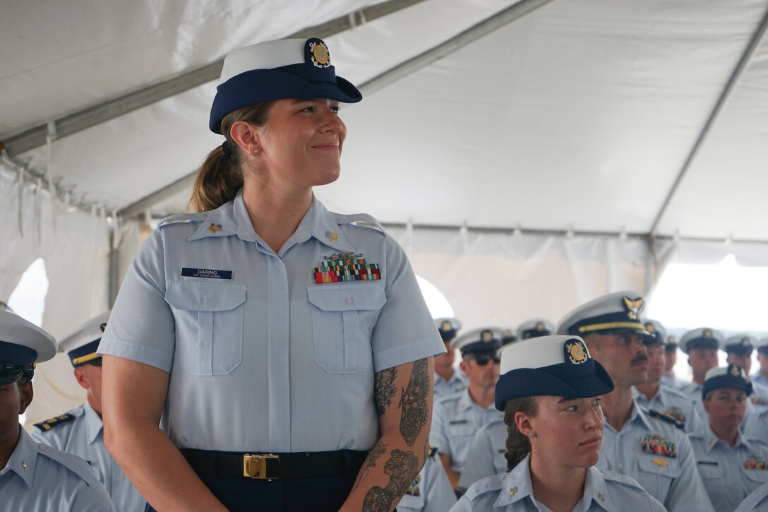 Petty Officer 2nd Class Andrea Daring, a crew member assigned to Coast Guard Cutter Stone (WMSL 758), is one of several members recognized by Capt. Jonathan Carter, commanding officer of Stone, for superior performance during the cutter's change-of-command ceremony in North Charleston, South Carolina, June 5, 2025. The change-of-command ceremony marks the official transfer of total responsibility, authority and accountability from one leader to another. (U.S. Coast Guard photo by Ensign Sarah Pearson)