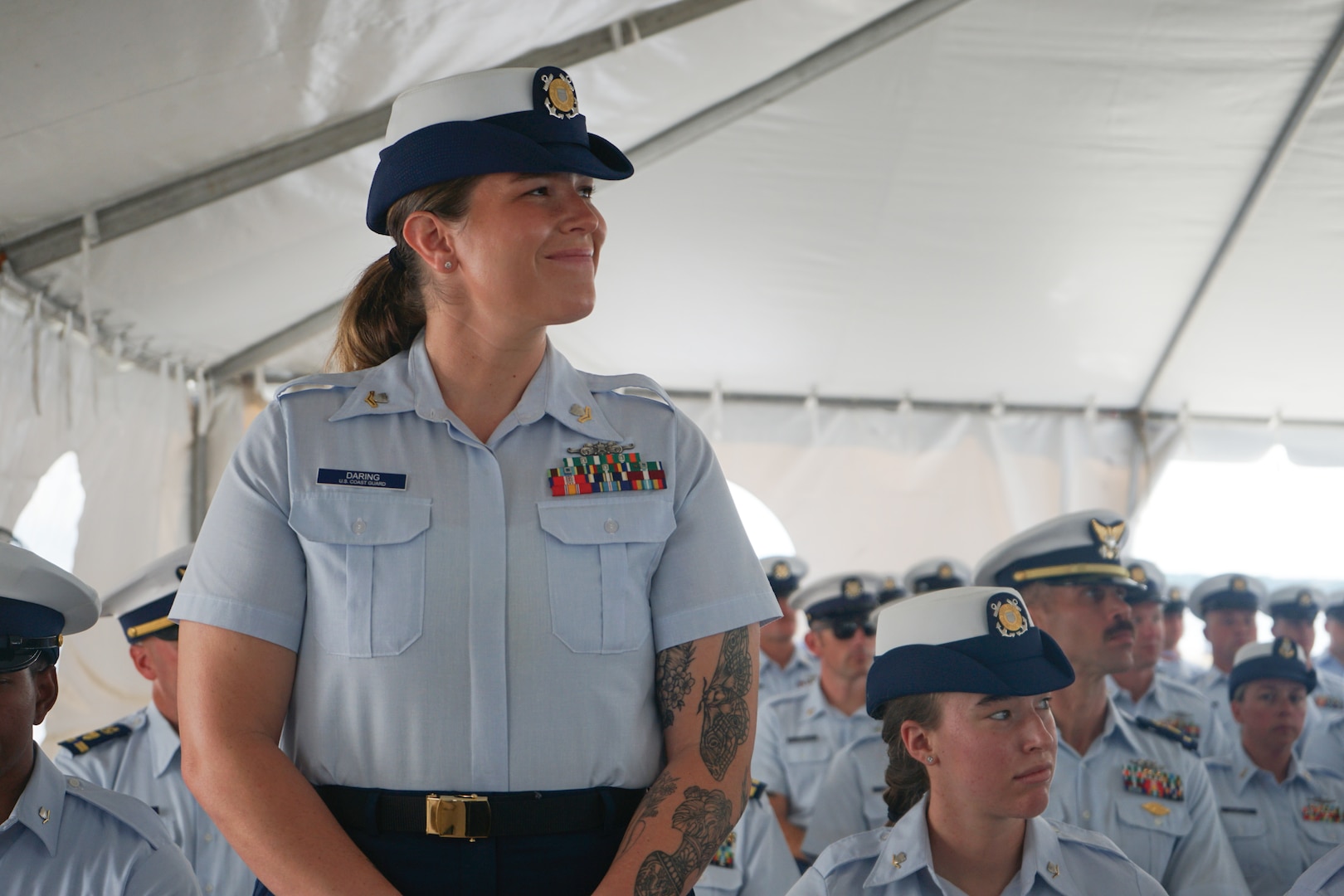 Petty Officer 2nd Class Andrea Daring, a crew member assigned to Coast Guard Cutter Stone (WMSL 758), is one of several members recognized by Capt. Jonathan Carter, commanding officer of Stone, for superior performance during the cutter's change-of-command ceremony in North Charleston, South Carolina, June 5, 2025. The change-of-command ceremony marks the official transfer of total responsibility, authority and accountability from one leader to another. (U.S. Coast Guard photo by Ensign Sarah Pearson)