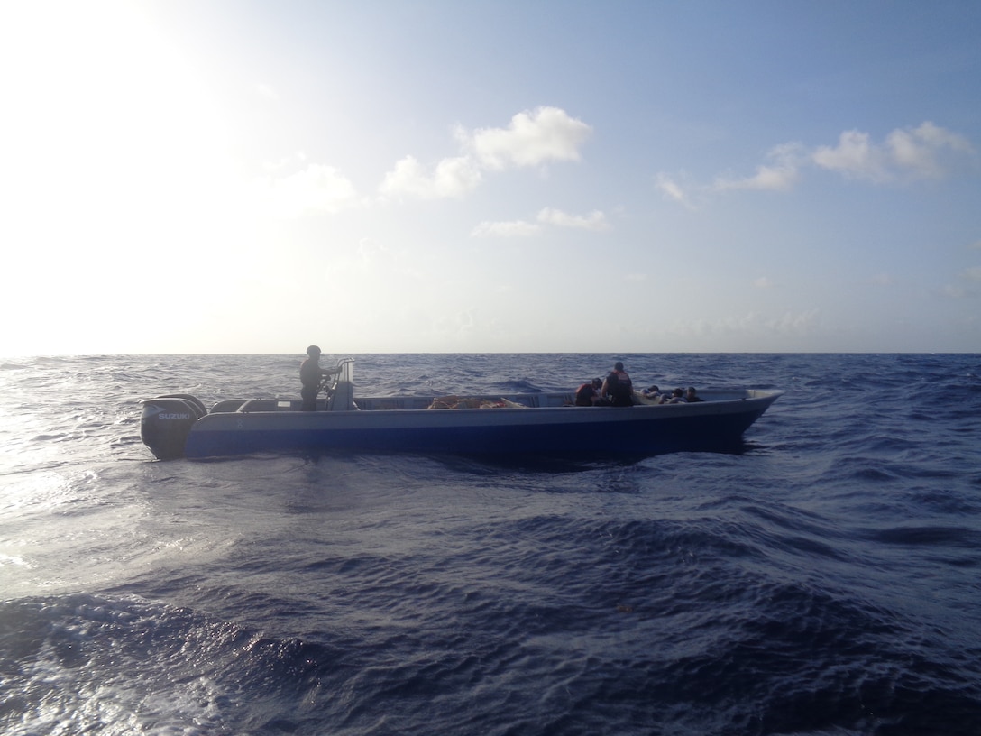 Coast Guard members drive a boat in the Caribbean Sea