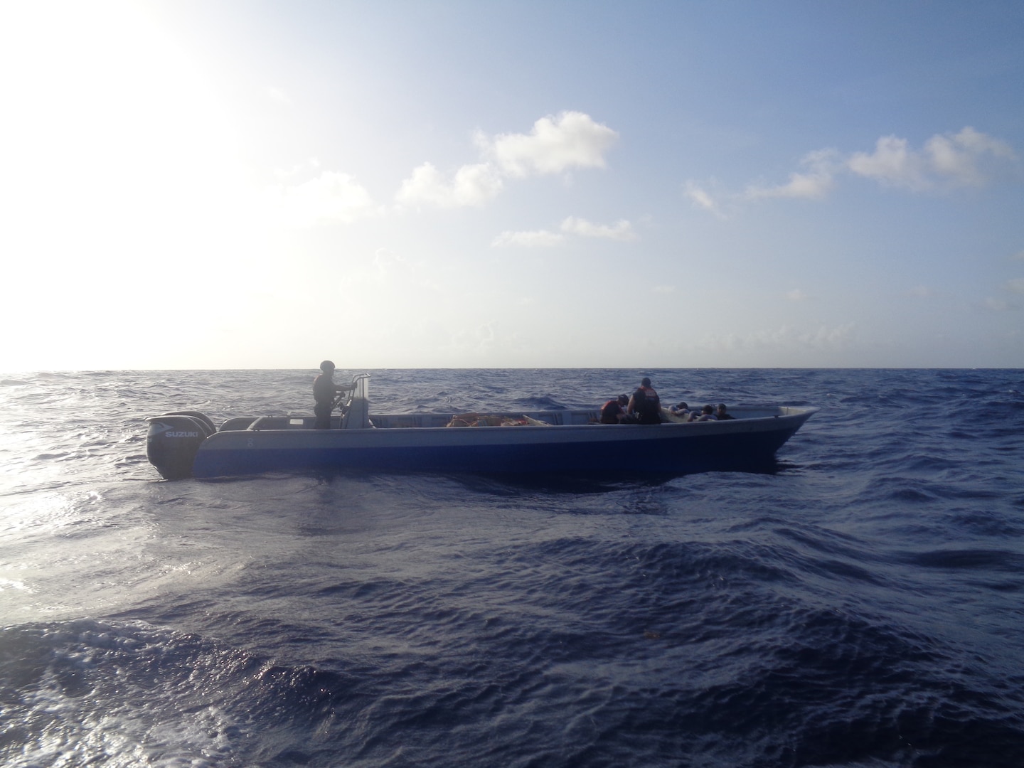 Coast Guard members drive a boat in the Caribbean Sea