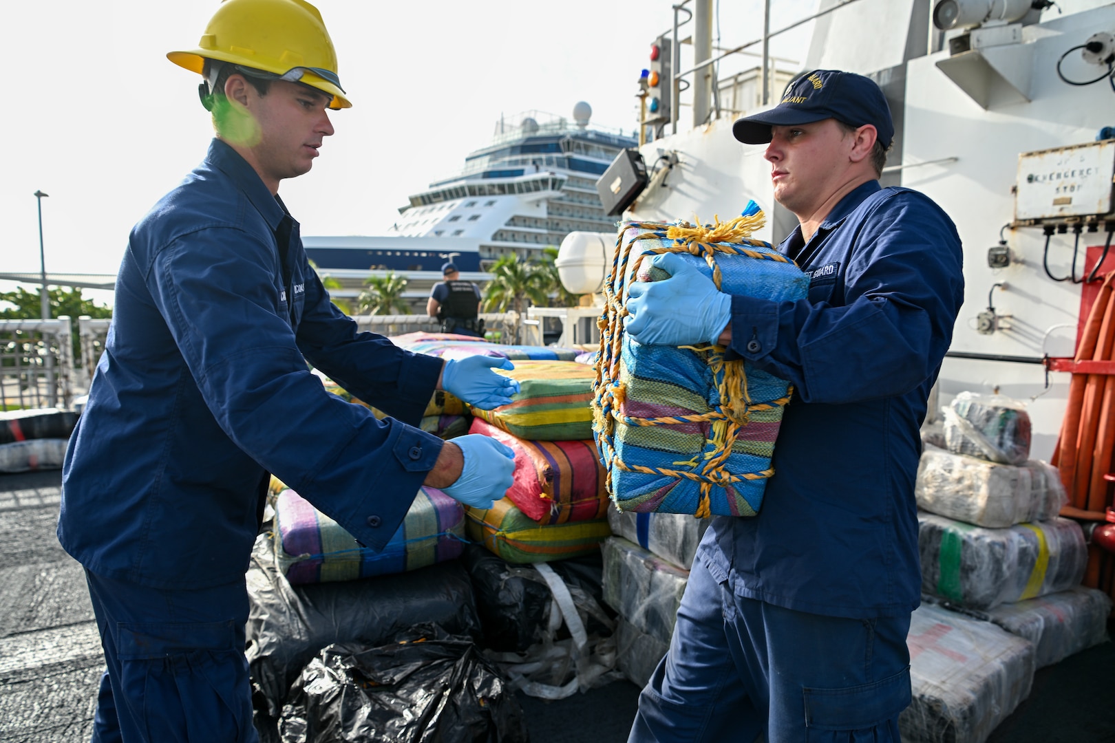 USCGC Valiant crew members offload drugs