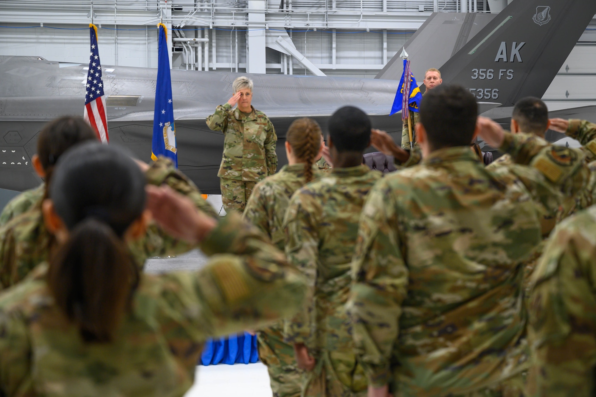 U.S. Air Force Col. Michele Suggs, 354th Medical Group incoming commander, renders an initial salute to the flight during the group change of command at Eielson Air Force Base, Alaska, June 6, 2025.