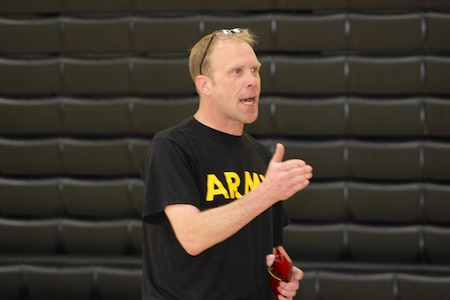 SSG Holliday speaks to students during a Fitness Challenge event at a local high school, May 2025. The event aimed to promote teamwork, physical fitness, and interest in Army career opportunities.