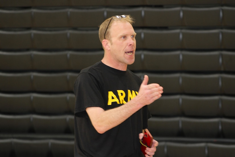 SSG Holliday speaks to students during a Fitness Challenge event at a local high school, May 2025. The event aimed to promote teamwork, physical fitness, and interest in Army career opportunities.