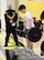 A U.S. Army recruiter looks on as a student performs the deadlift event during the U.S. Army Fitness Challenge at Shawnee Mission West High School in May 2025. The challenge provided an opportunity for students to test their strength and learn about Army fitness standards.