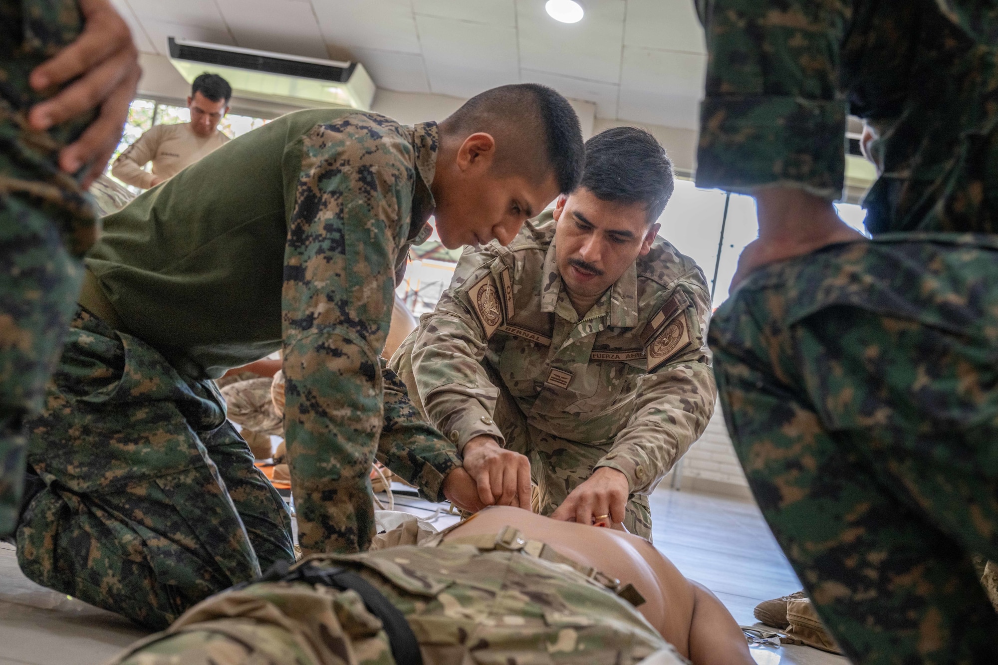 Members of the Peruvian armed forces practice Tactical Combat Casualty Care in Iquitos, Peru, June 3, 2025. The training, part of the AMISTAD medical engagement, simulates battlefield conditions where TCCC techniques are critical for saving lives and stabilizing patients in austere environments. (U.S. Air Force photo by Senior Airman Victoria Edwards)