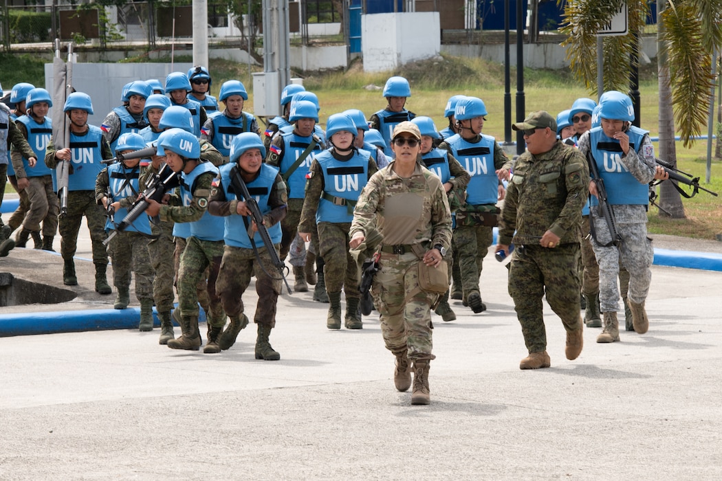 U.S. Air Force Staff Sgt. Maritza Garcia, 154th Medical Group Detachment 1 medic and Tactical Combat Casualty Care instructor, guides Armed Forces of the Philippines students during a medical field training exercise May 29, 2025, at Camp O’Donnell, Philippines.