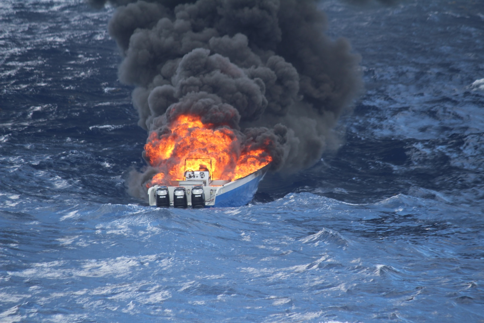 A boat burns in the Caribbean Sea