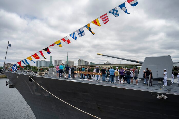 PORTLAND, Ore. (June 5, 2025) – Guests receive a ship tour aboard the Arleigh Burke-class guided-missile destroyer USS Jack H. Lucas (DDG 125) during Portland Fleet Week as part of the 118th Rose Festival, June 5, 2025. Portland Fleet Week is a time-honored celebration of the sea services and provides an opportunity for the citizens of Oregon to meet Sailors, Marines and Coast Guardsmen, as well as witness firsthand the latest capabilities of today’s maritime services. (U.S. Navy Photo by Mass Communication Specialist Seaman Jordan Steis)
