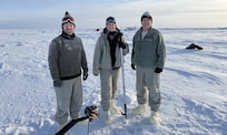 In February 2025, Arctic researchers William Jenkins, U.S. Navy Lt. Caroline Kelly, and Benjamin Reeder (left to right) conducted cryoacoustics experiments on sea ice floating in the Arctic Ocean to improve current and future U.S. naval operations in this growingly contested environment. (Courtesy photo from Mike Demello, Arctic Submarine Laboratory)