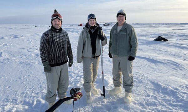 In February 2025, Arctic researchers William Jenkins, U.S. Navy Lt. Caroline Kelly, and Benjamin Reeder (left to right) conducted cryoacoustics experiments on sea ice floating in the Arctic Ocean to improve current and future U.S. naval operations in this growingly contested environment. (Courtesy photo from Mike Demello, Arctic Submarine Laboratory)