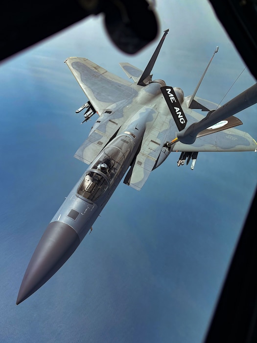An F-15C Eagle from the 104th Fighter Wing, Westfield, Ma, receives a mid-air refuel by a KC-135 from the 101st Air Refueling Wing