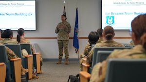 Chief briefing Airmen at commander support staff conference.