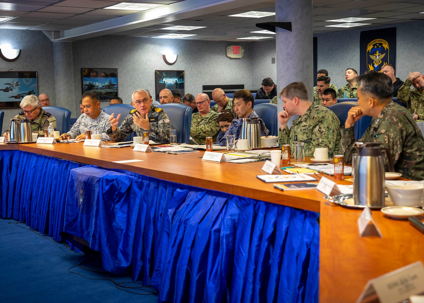 250530-N-WM182-1076 SYDNEY (May 30, 2025) Australian Fleet Commander Rear Adm. Chris Smith speaks during a gathering of naval leaders from Australia, Canada, France, Japan, the Republic of Korea, New Zealand, the Philippines, and the U.S. aboard the U.S. 7th Fleet flagship USS Blue Ridge (LCC 19) for the Fleet Commanders' Round Table in Sydney while the ship conducts a scheduled port visit, May 30, 2025. 7th Fleet is the U.S. Navy's largest forward-deployed numbered fleet, and routinely interacts and operates with allies and partners in preserving a free and open Indo-Pacific region. (U.S. Navy Photo by Mass Communication Specialist 1st Class Caitlin Flynn)