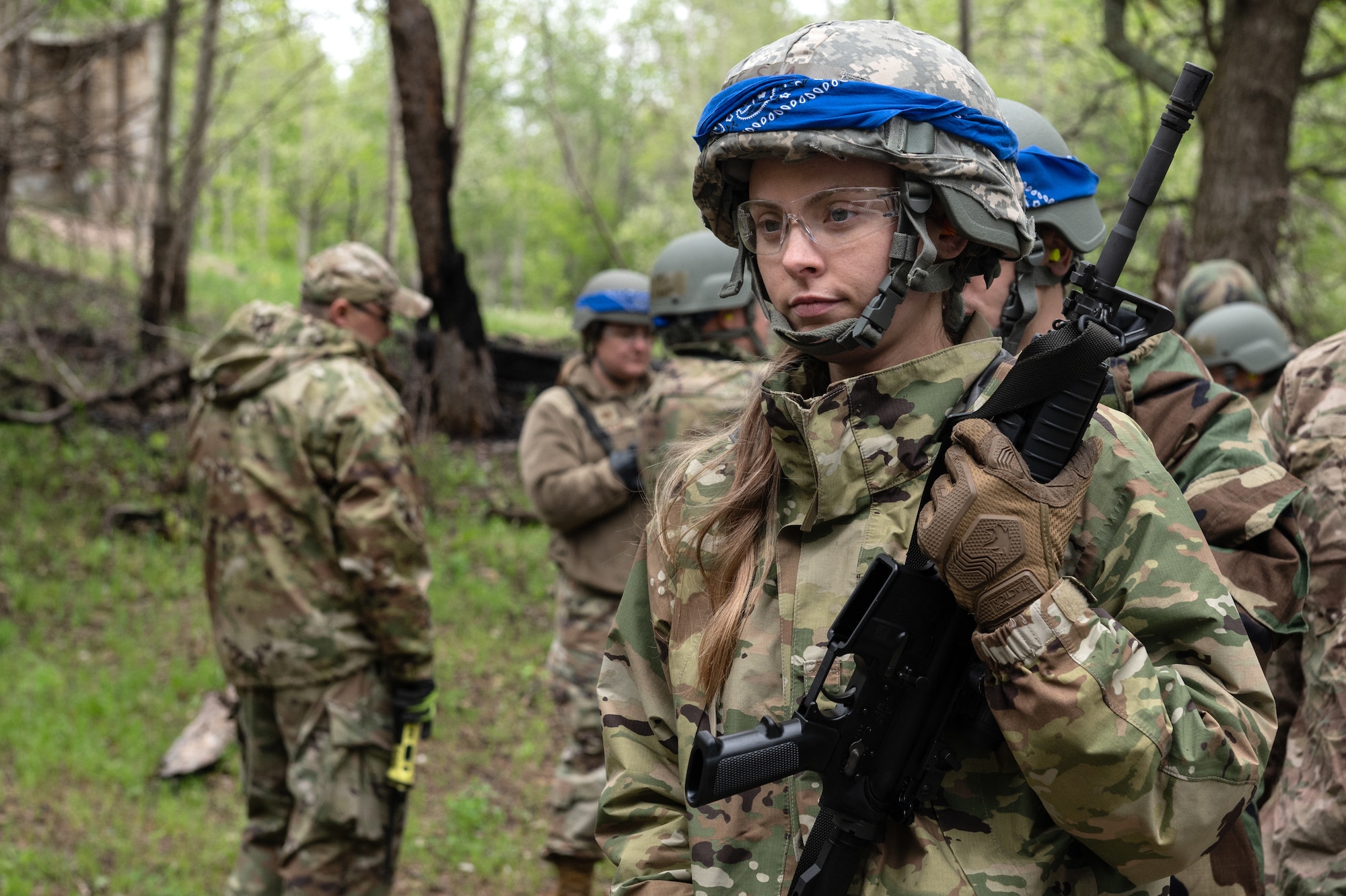 U.S. Air Force Senior Airman Emily Nelson from the 133rd Logistics Readiness Squadron waits to clear her weapon in Camp Ripley, Minn., May 17, 2025.