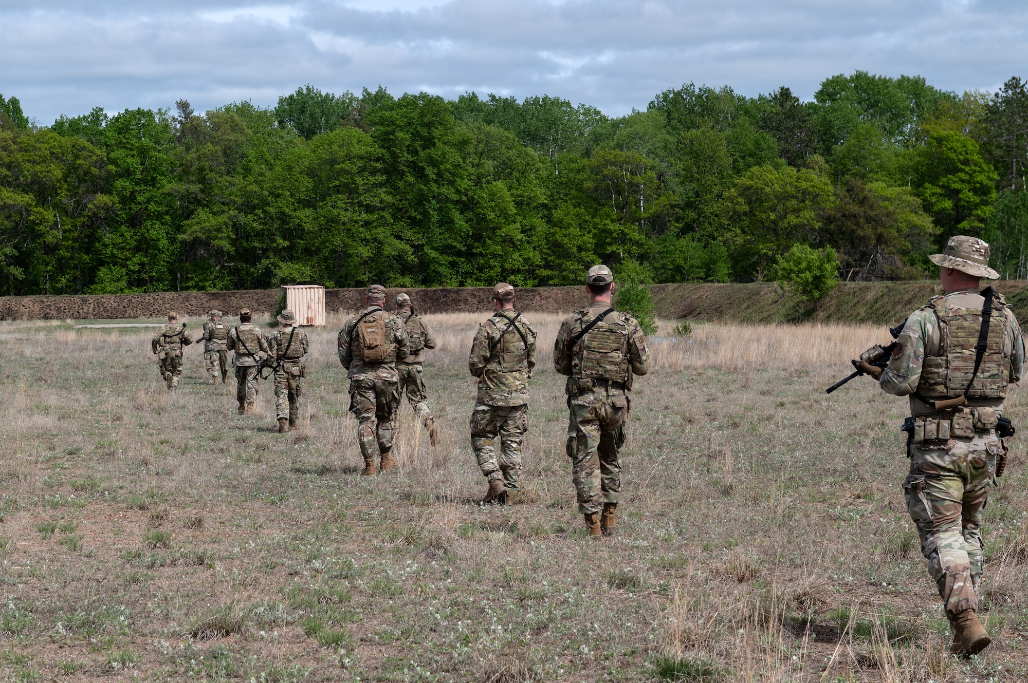 U.S. Air Force Airmen from the 133rd Security Forces Squadron, Minnesota Air National Guard, patrol the field in Camp Ripley, Minn., May 18, 2025.