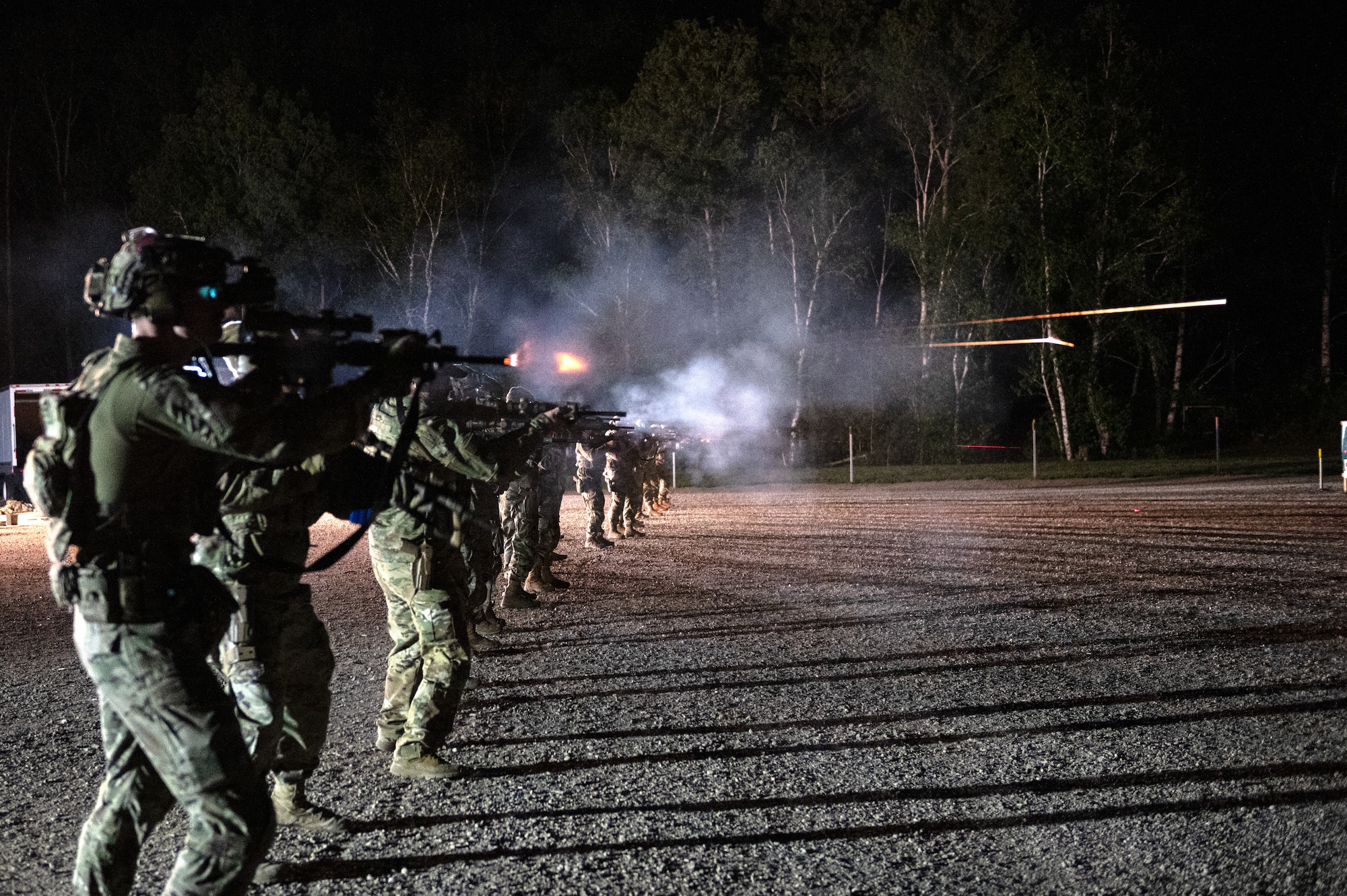 U.S. Air Force Airmen from the 133rd Security Forces Squadron, Minnesota Air National Guard, fires a M4 rifle during nighttime qualification in Camp Ripley, Minn., May 18, 2025.