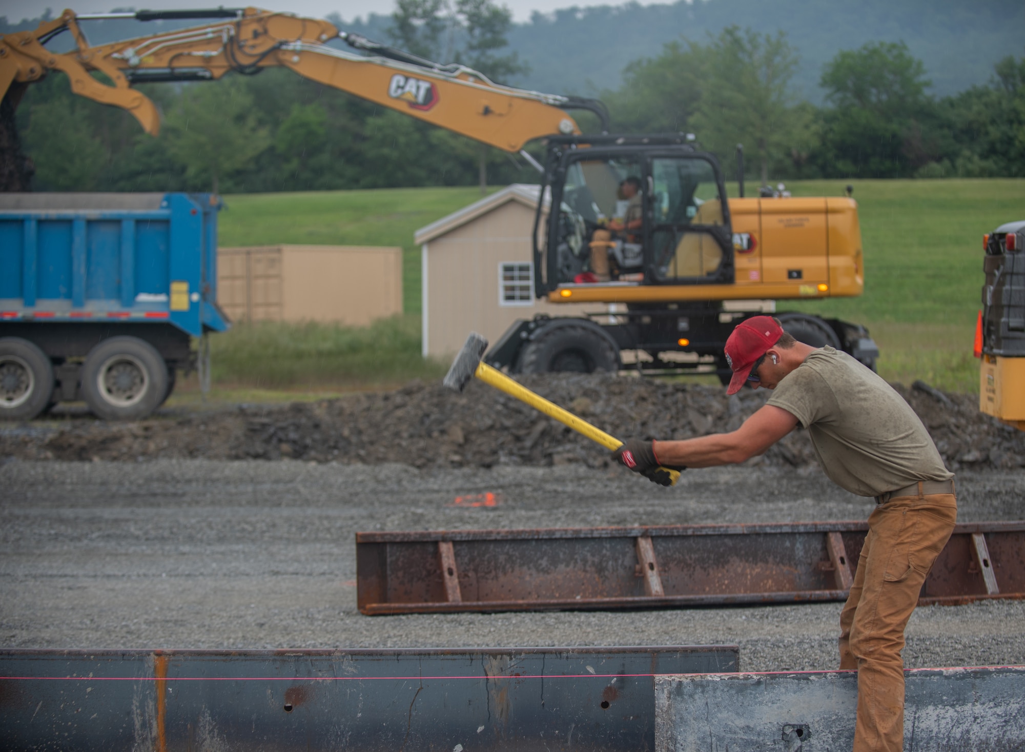 Airman 1st Class Nicholas Vallario, pavements and construction equipment specialist with the 201st RED HORSE Detachment 1, constructs a Rapid Airfield Damage Repair system at Fort Indiantown Gap, Pennsylvania, June 6, 2025.