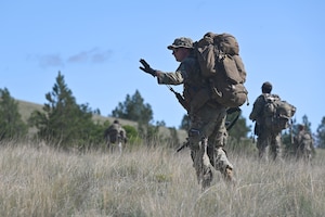 Defenders from the 161st, 162nd, and 171st Security Forces Squadrons conduct a patrol during a field training exercise at Ft. William Henry Harrison.