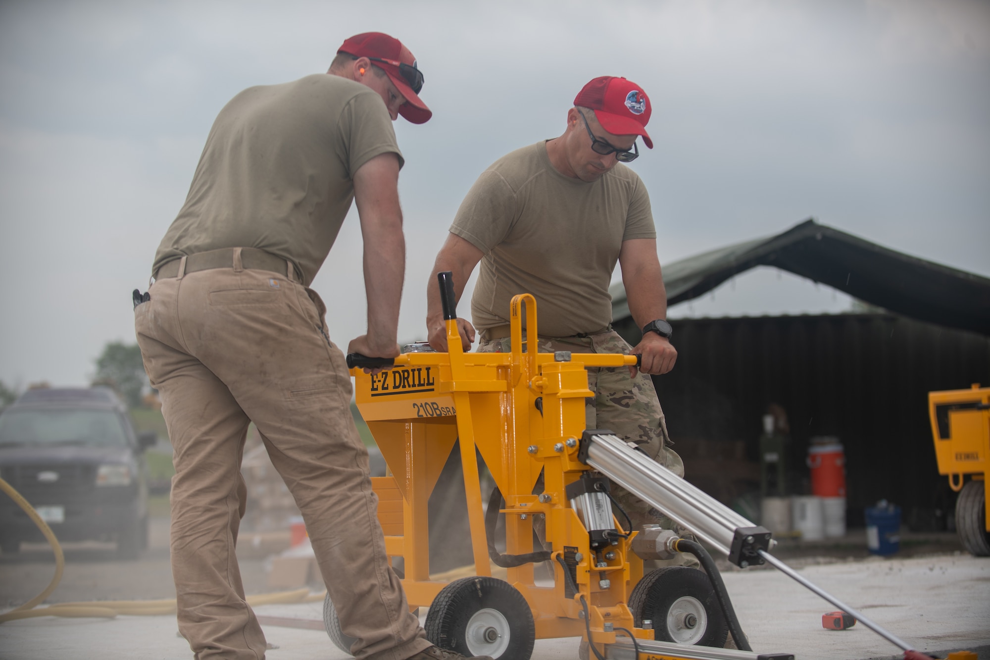 Tech Sgt. William Leinbach, assigned to the 201st RED HORSE, drills concrete at Fort Indiantown Gap, Pennsylvania, June 7, 2025.