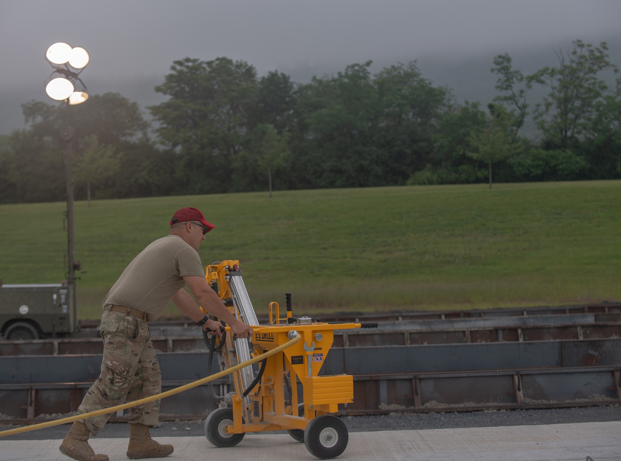 Tech Sgt. William Leinbach, assigned to the 201st RED HORSE, drills concrete at Fort Indiantown Gap, Pennsylvania, June 7, 2025.