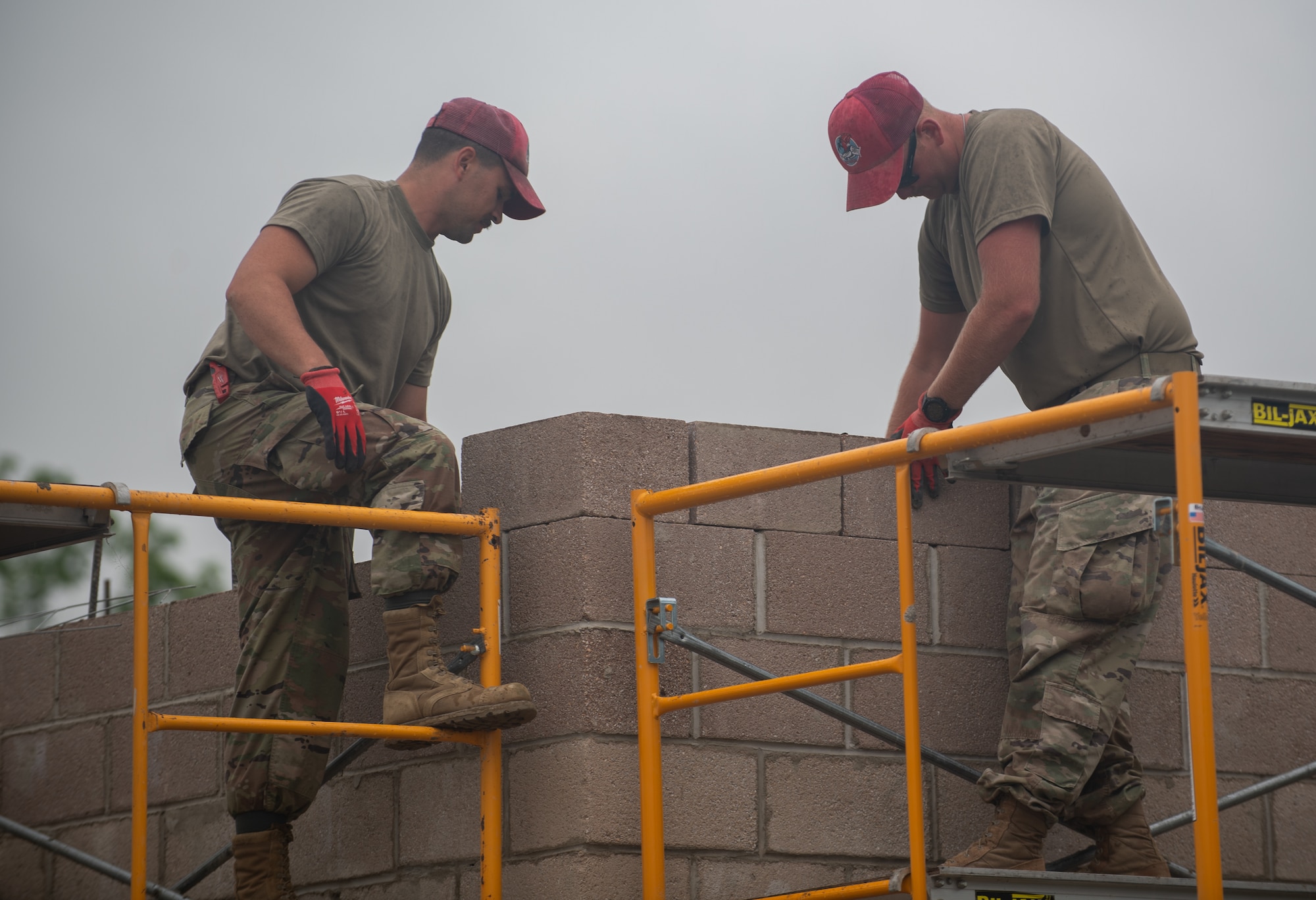 Staff Sgt. Ian Fogleman (left) and Staff Sgt. Dakota Morgan, structures specialists assigned to the 201st RED HORSE Squadron, construct a new range tower at Fort Indiantown Gap, Pennsylvania, June 6, 2025.