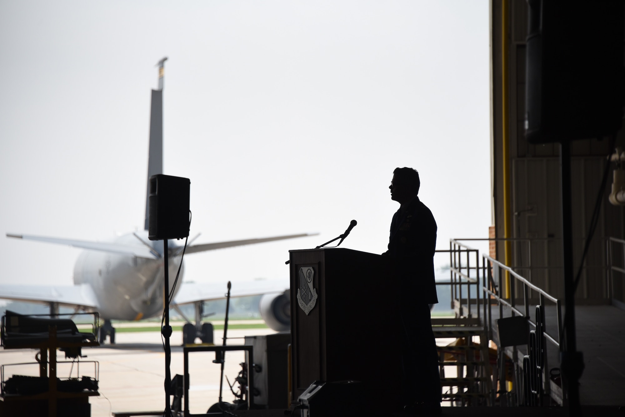 Col. Adam Carlson stands behind podium