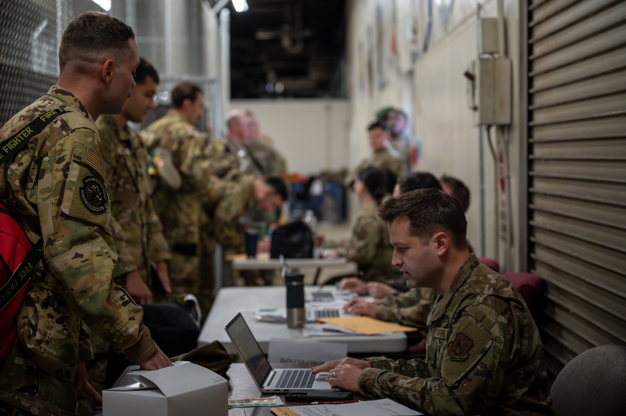 Airmen from the 419th Fighter Wing process through a mock deployment line during an exercise at Hill Air Force Base, Utah, May 6, 2025.