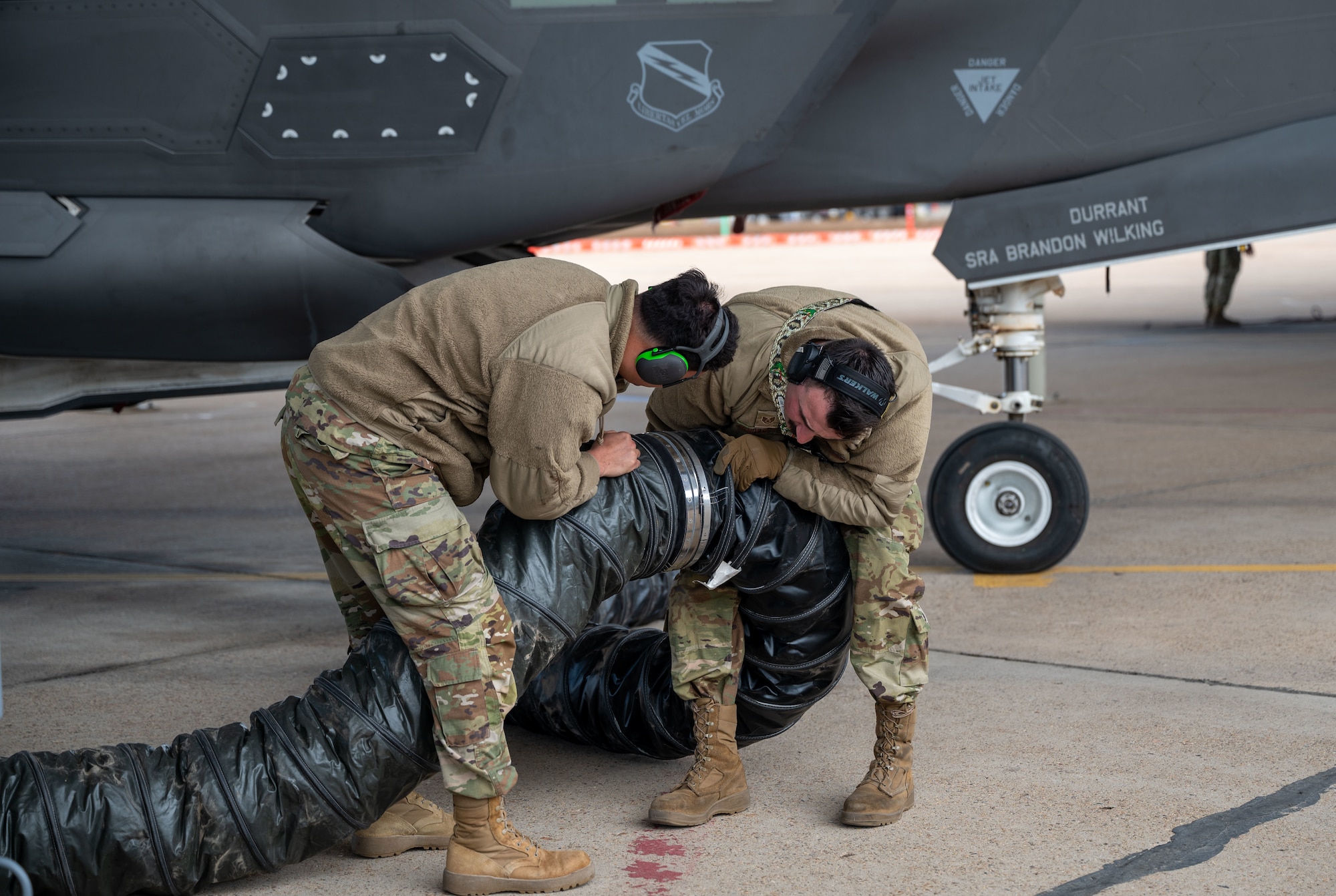 Tech. Sgt. James Jones and Staff Sgt. Auston Vandersteen, 419th Fighter Wing Aircraft Maintenance Squadron, break down equipment following maintenance during an exercise at Hill Air Force Base, Utah, May 6, 2025.
