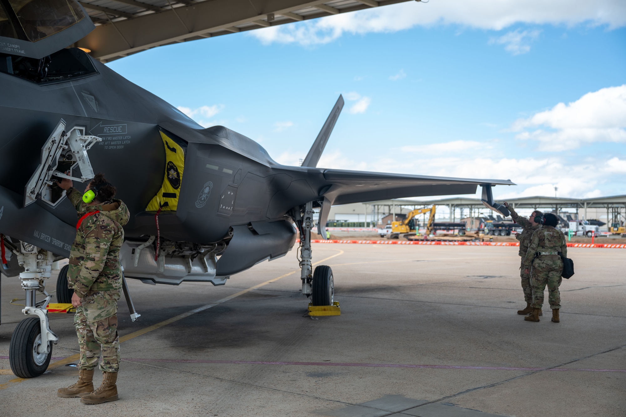 Staff Sgt. James Abernathy, Senior Airman Joezara Sarvello, and Senior Airman Jessica Henriquez Gutierrez, 419th Fighter Wing Aircraft Maintenance Squadron, perform maintenance on an F-35 A during an exercise at Hill Air Force Base, Utah, May 6, 2025.