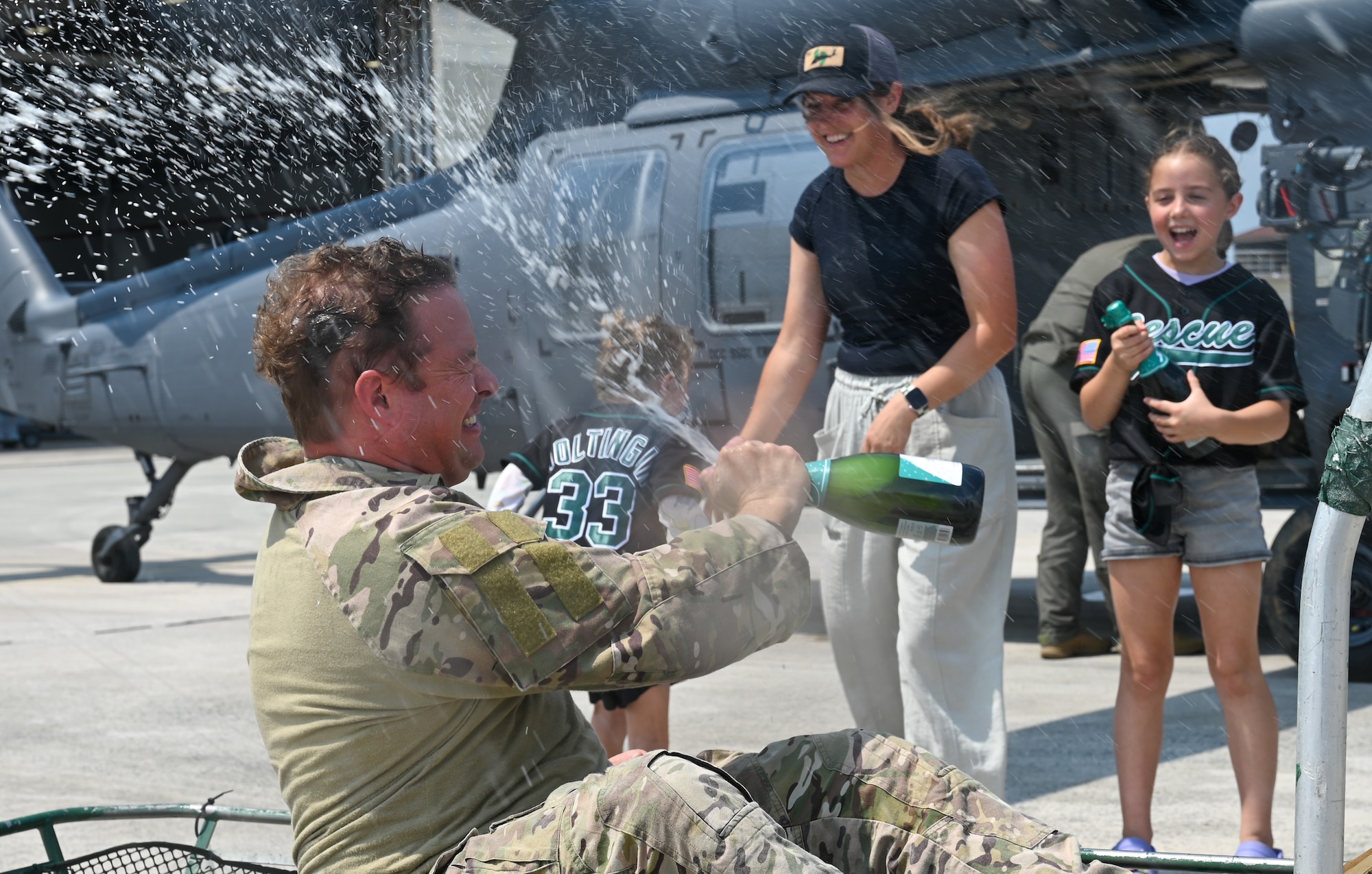 A U.S. servicemember celebrates with his family.