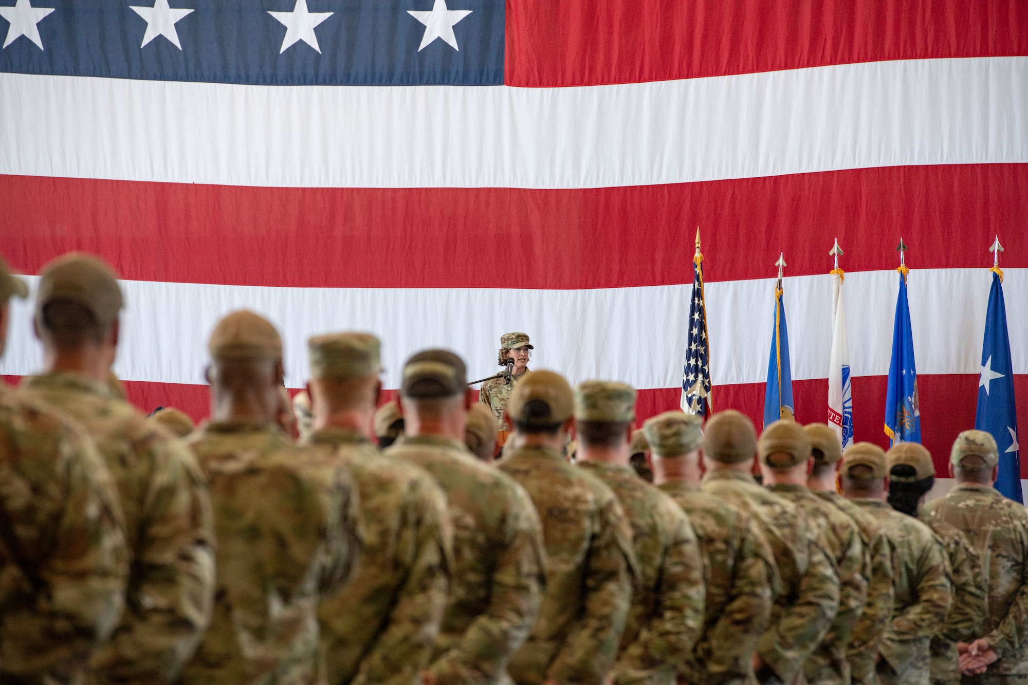 A military commander addresses a formation of airmen.