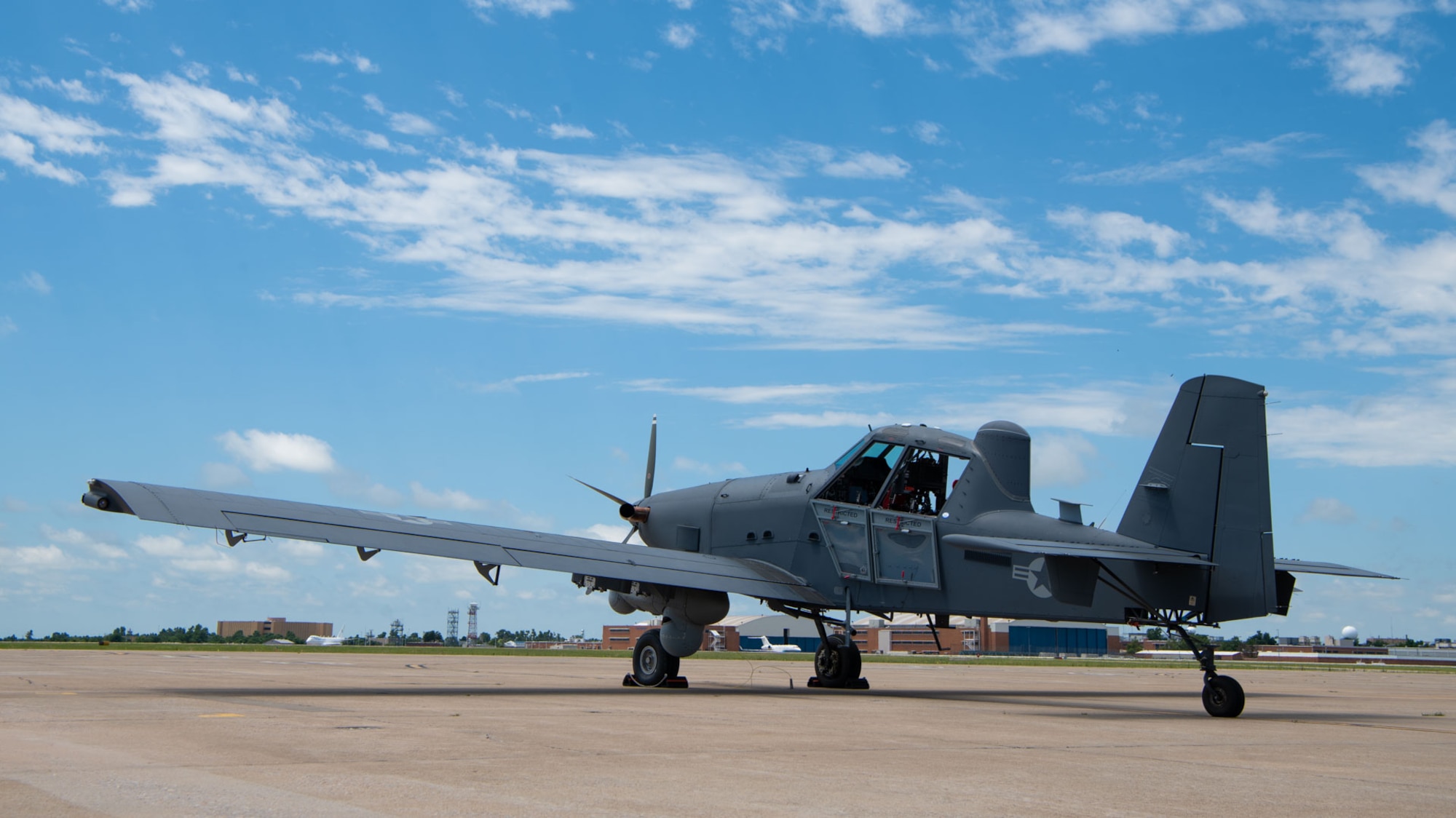 an aircraft sits on a flightline