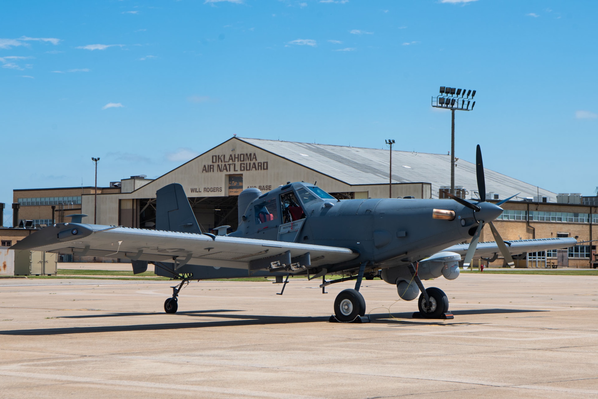 an aircraft sits on a flightline