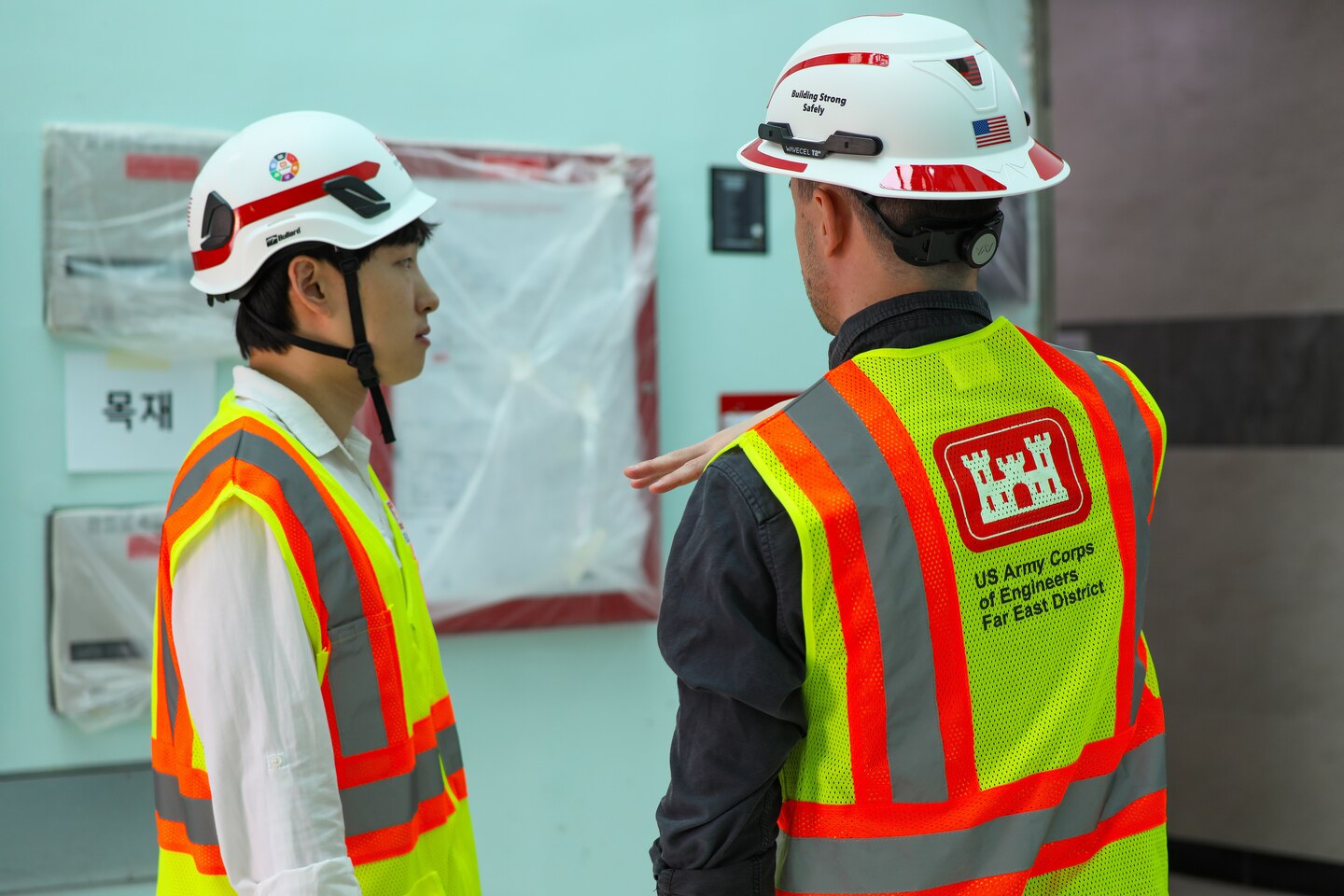 FED employees discuss the process of construction.