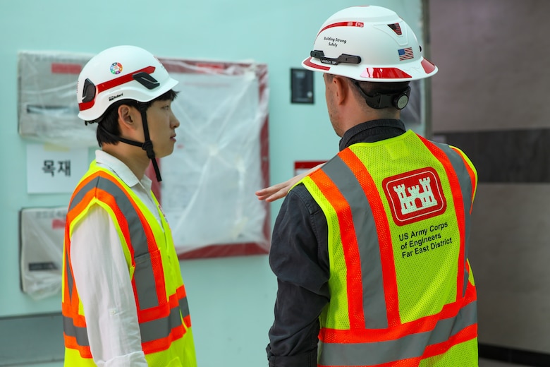 FED employees discuss the process of construction.