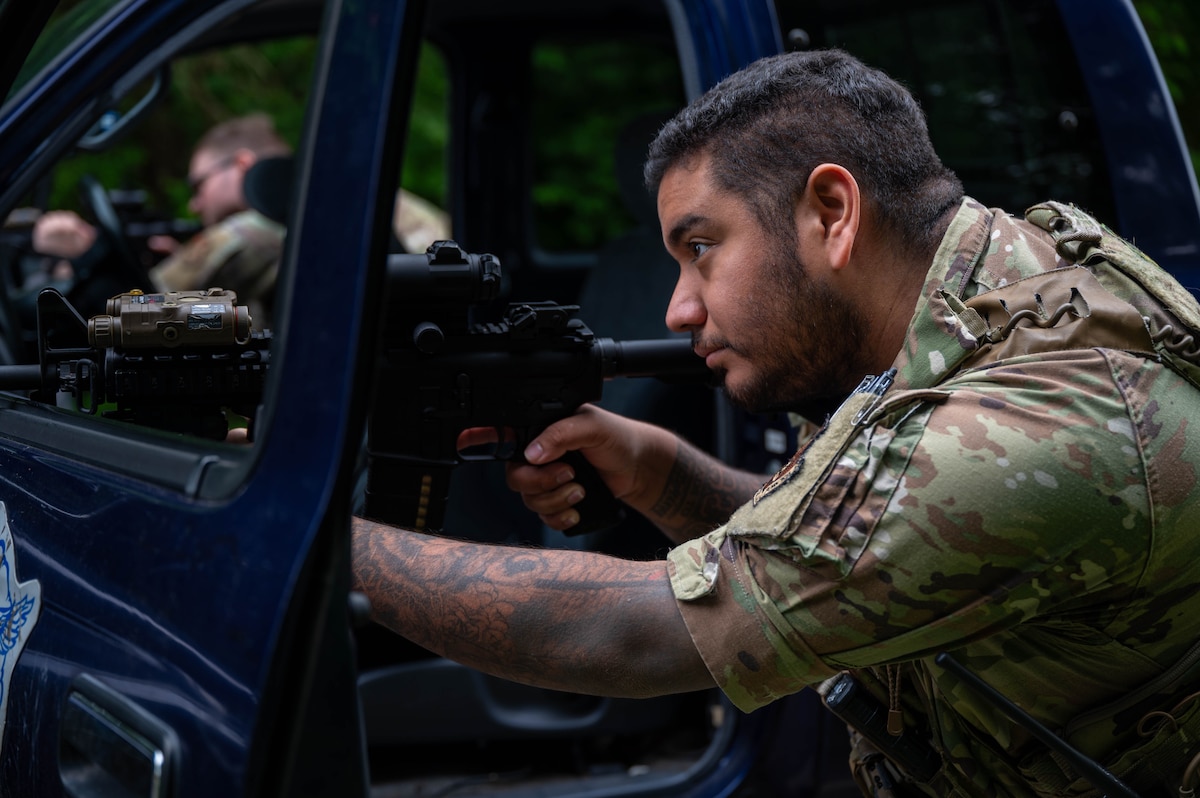 U.S. Air Force Senior Airman Alexander Garcia, 35th Security Forces Squadron patrolman, aims his M4 carbine during a mid-patrol training exercise at Misawa Air Base, Japan, June 5, 2025
