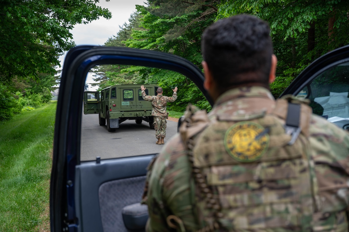 U.S. Air Force Technical Sgt. Joseph Westphal, 35th Security Forces Squadron (SFS) patrol-flight NCOIC, left, and Senior Airman Alexander Garcia, 35th SFS patrolman, right, simulate detaining procedures during a mid-patrol training exercise at Misawa Air Base, Japan, June 5, 2025.