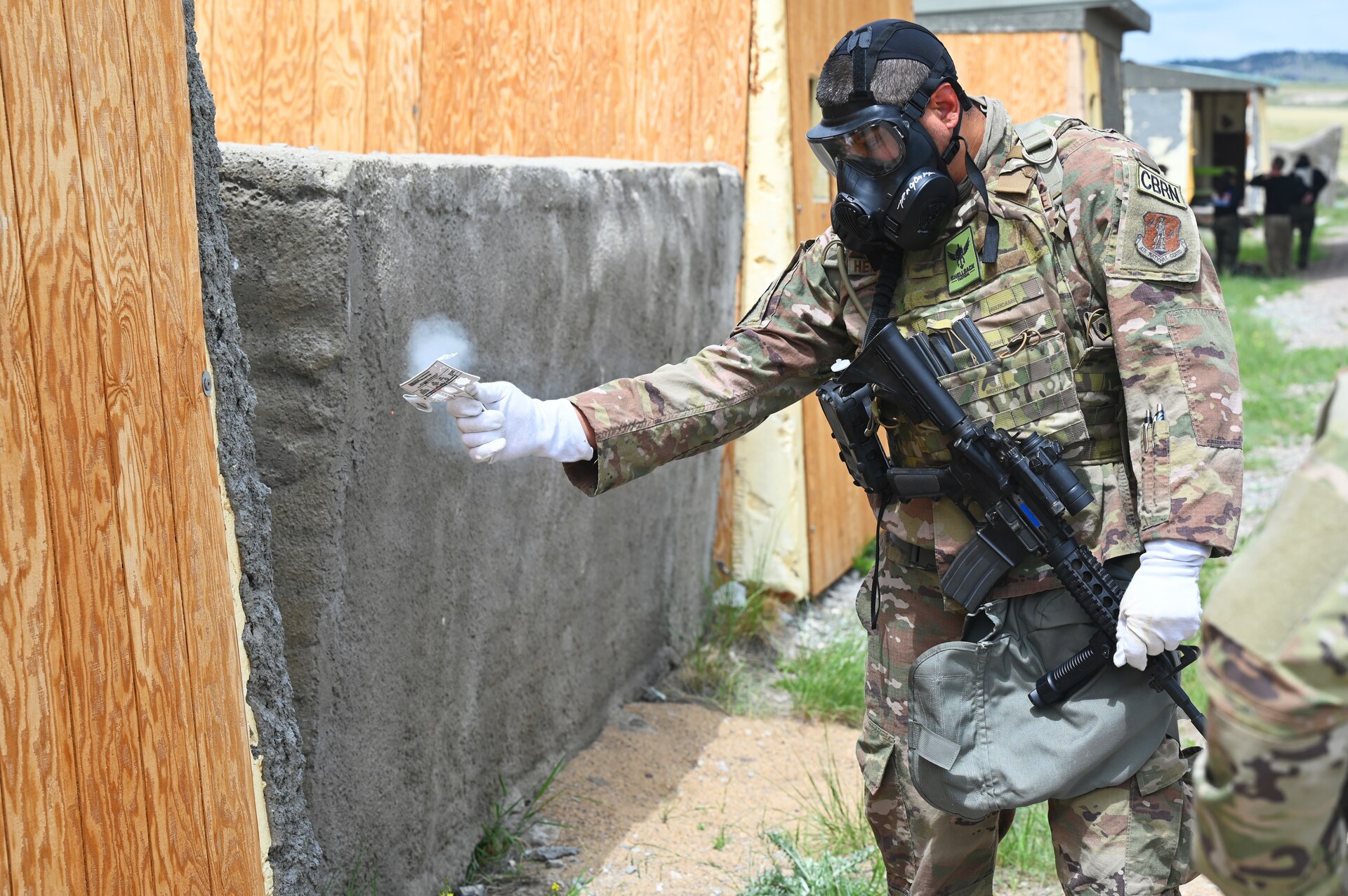 A chemical, biological, radiological, nuclear and high yield explosives (CBRNE) specialist from the 161st Civil Engineering Squadron tests for simulated contamination during a training exercise.