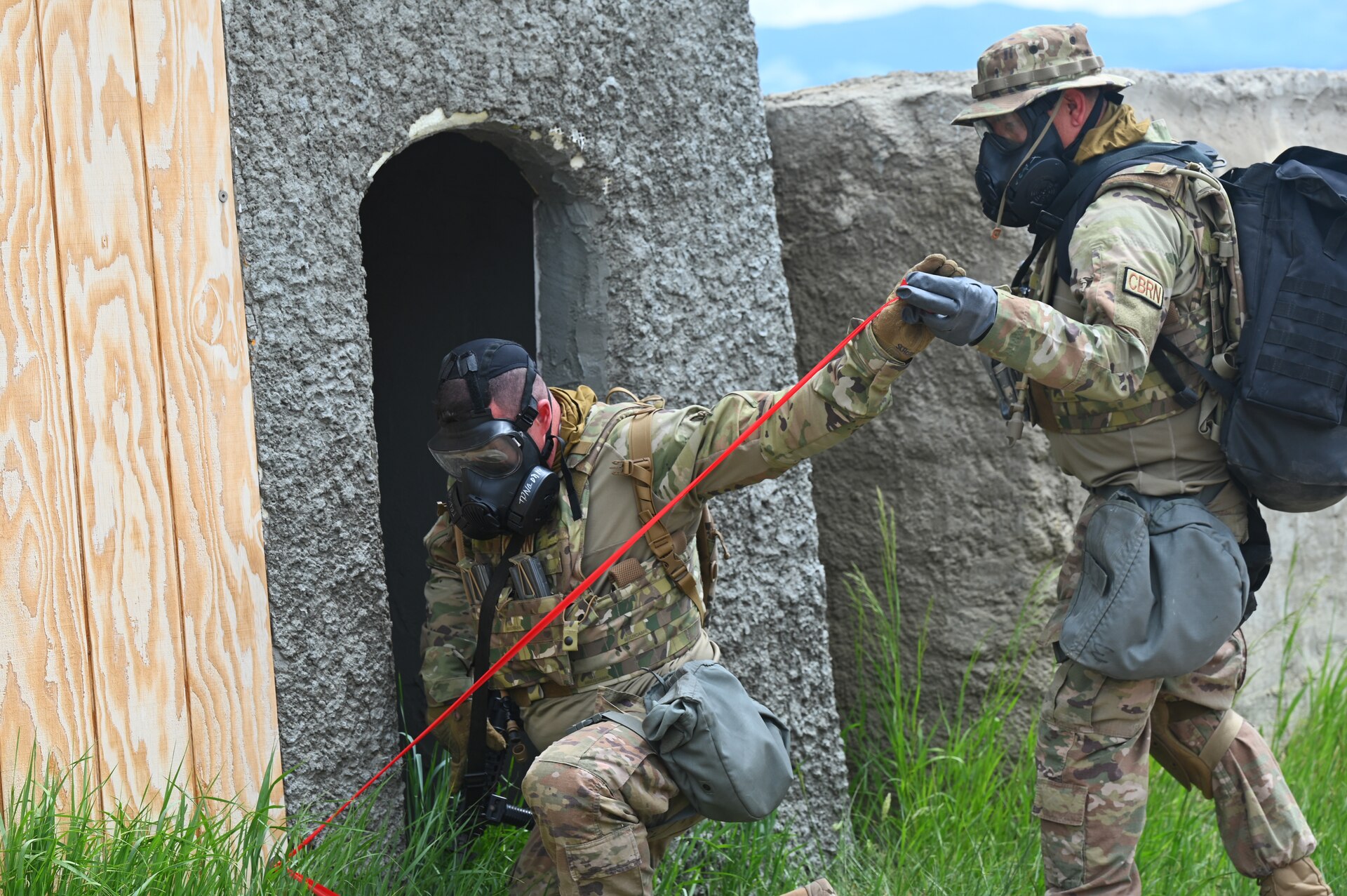 Chemical, biological, radiological, nuclear and high yield explosives (CBRNE) specialists from the 161st Civil Engineering Squadron cordon an area of simulated contamination during a training exercise.