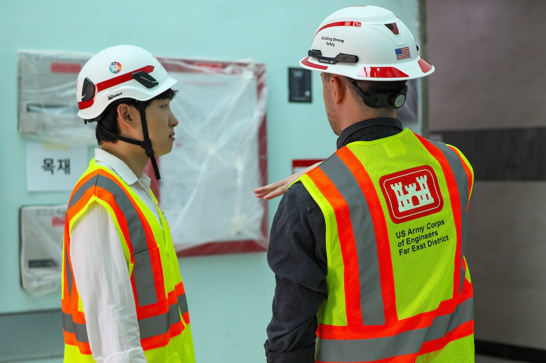 FED employees discuss the process of construction.