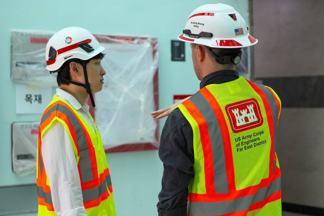 FED employees discuss the process of construction.