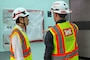 FED employees discuss the process of construction.