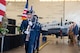 an uniformed color guard performs at a ceremony