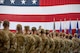 A military commander addresses a formation of airmen.