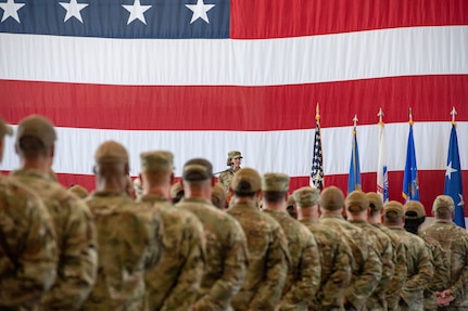 A military commander addresses a formation of airmen.
